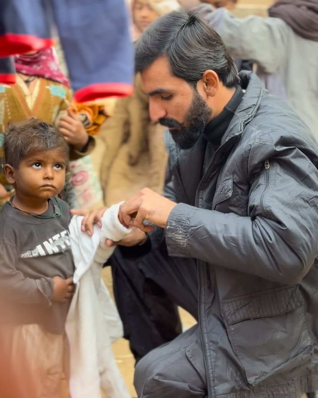 Children receiving school supplies.